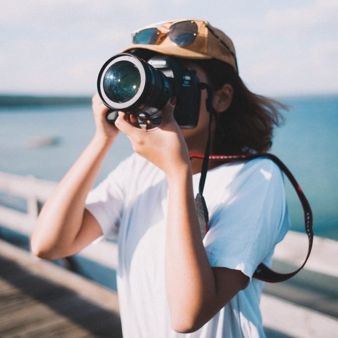 girl holdings binoculars